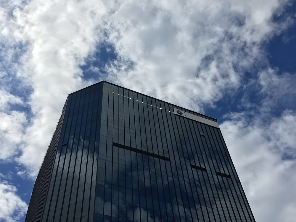 low angle photography of high rise building under blue sky during daytime