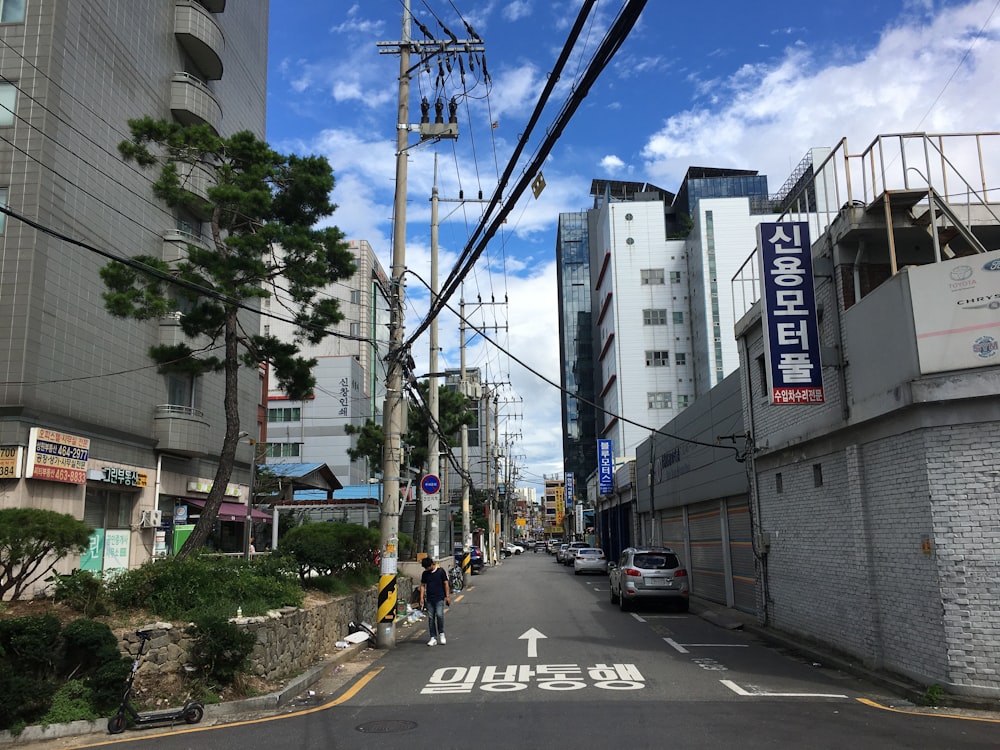 cars on road near buildings during daytime