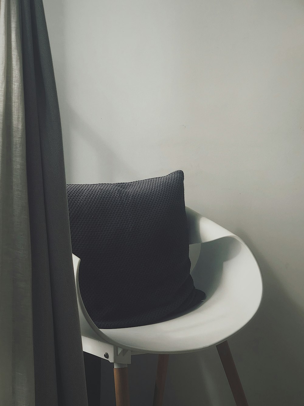 black and white fedora hat on white table