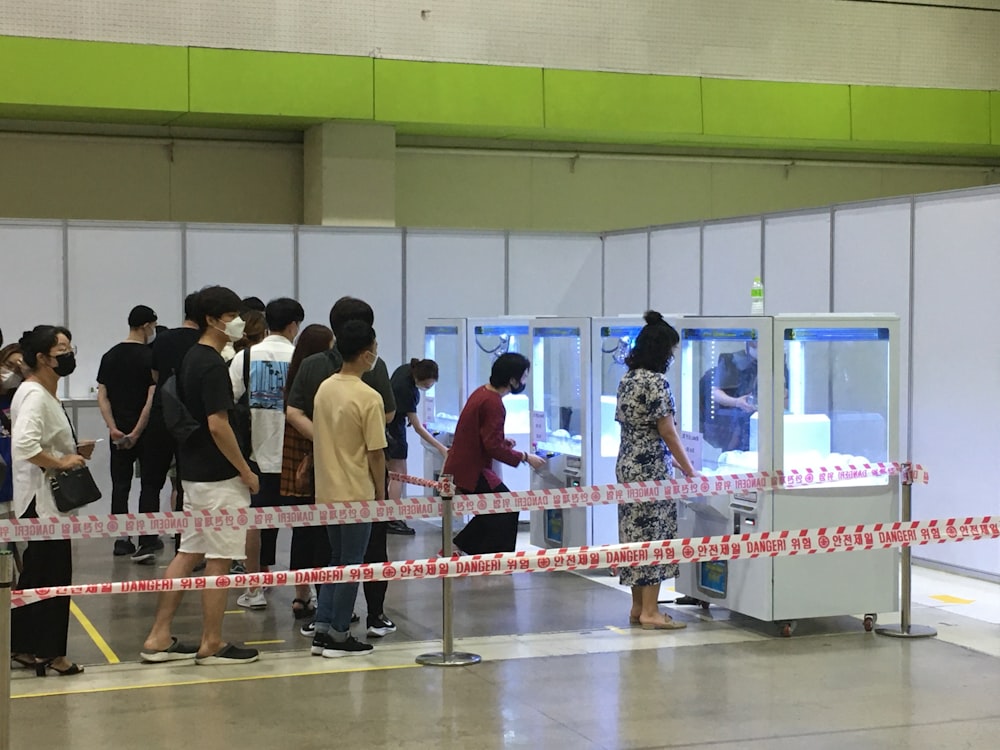 people standing in front of white table