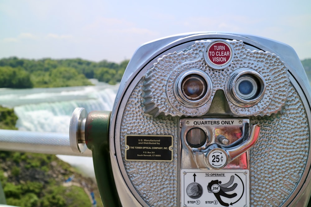 gray and black coin operated binoculars