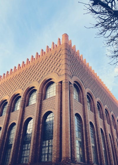 brown concrete building under blue sky during daytime