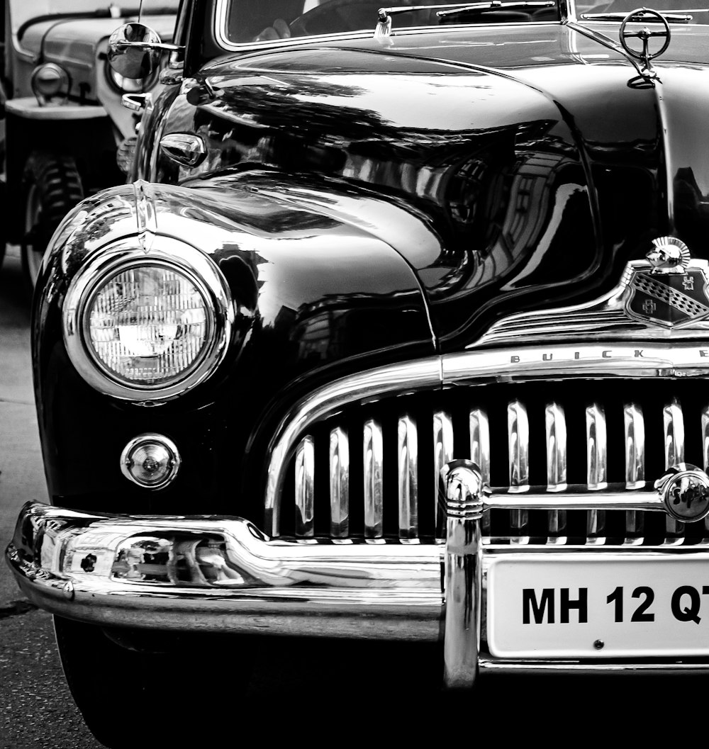 grayscale photo of vintage car