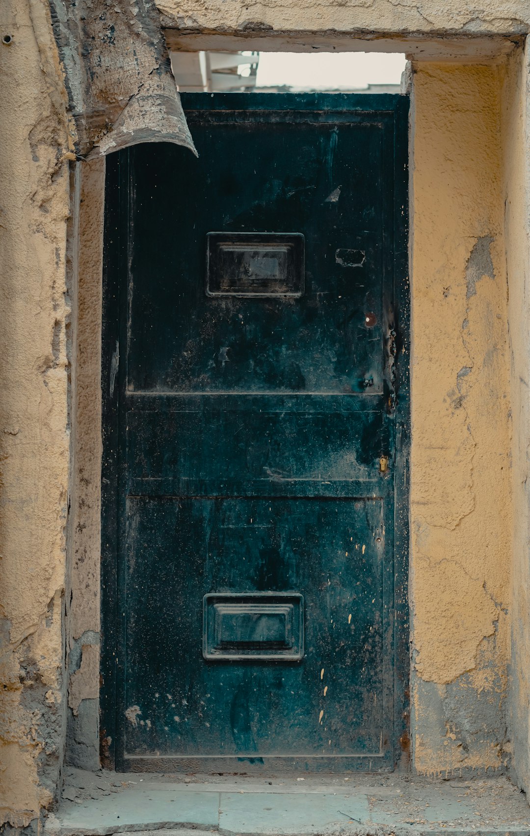 black wooden door with silver door lever