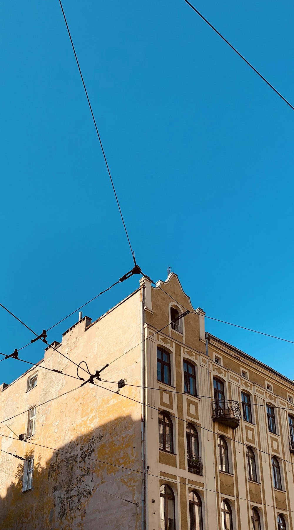 brown concrete building under blue sky during daytime