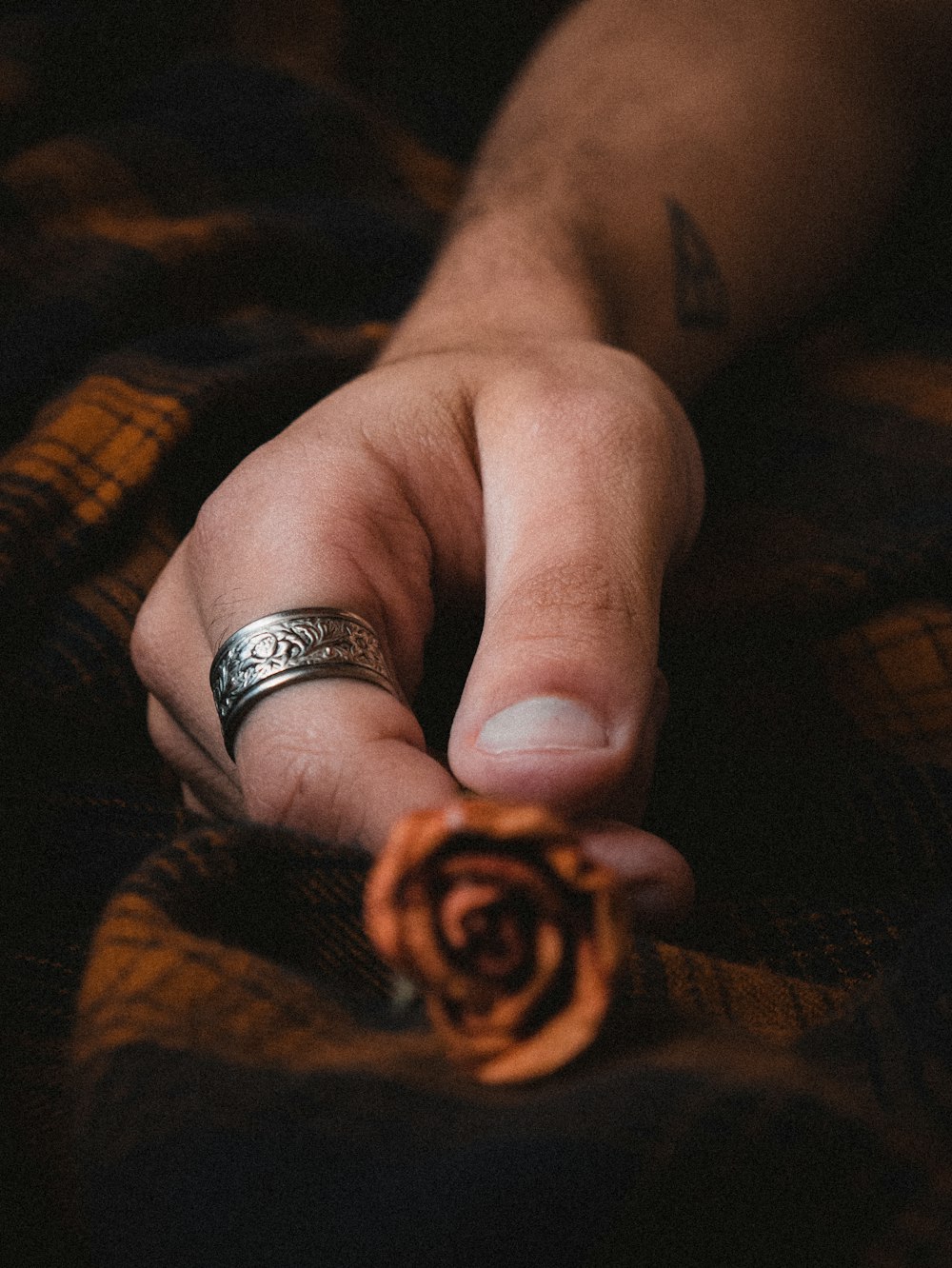 person wearing silver and gold ring