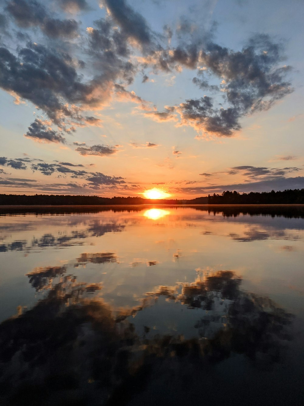 body of water under blue sky during daytime