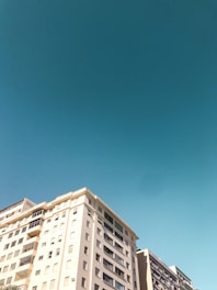 white concrete building under blue sky during daytime