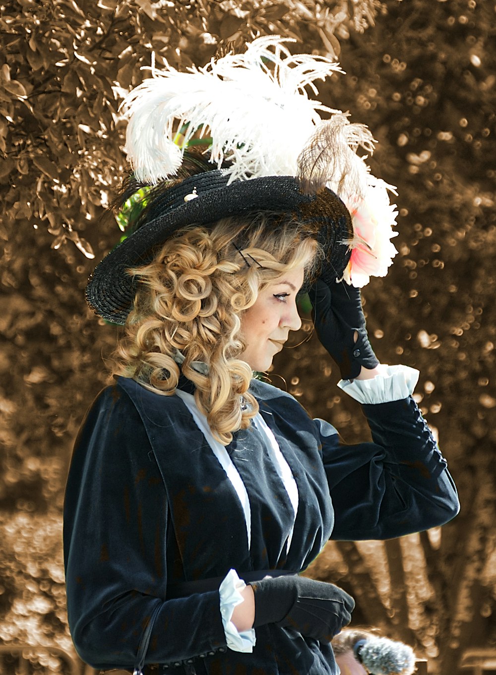 woman in black jacket and white floral headdress