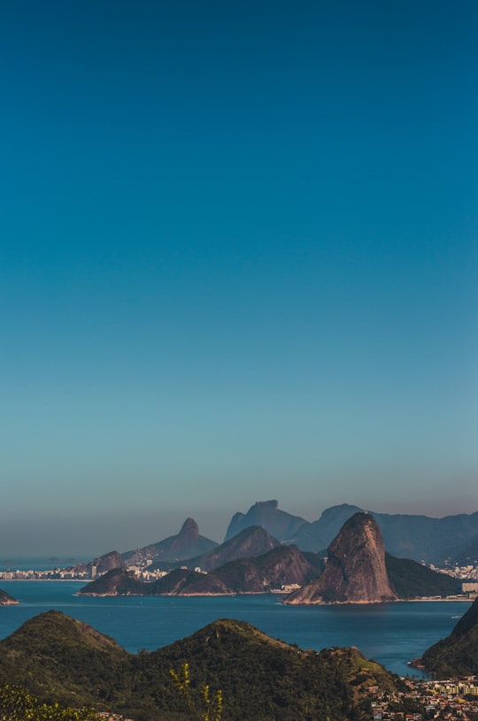 brown mountain under blue sky during daytime in Niterói City Park Brasil