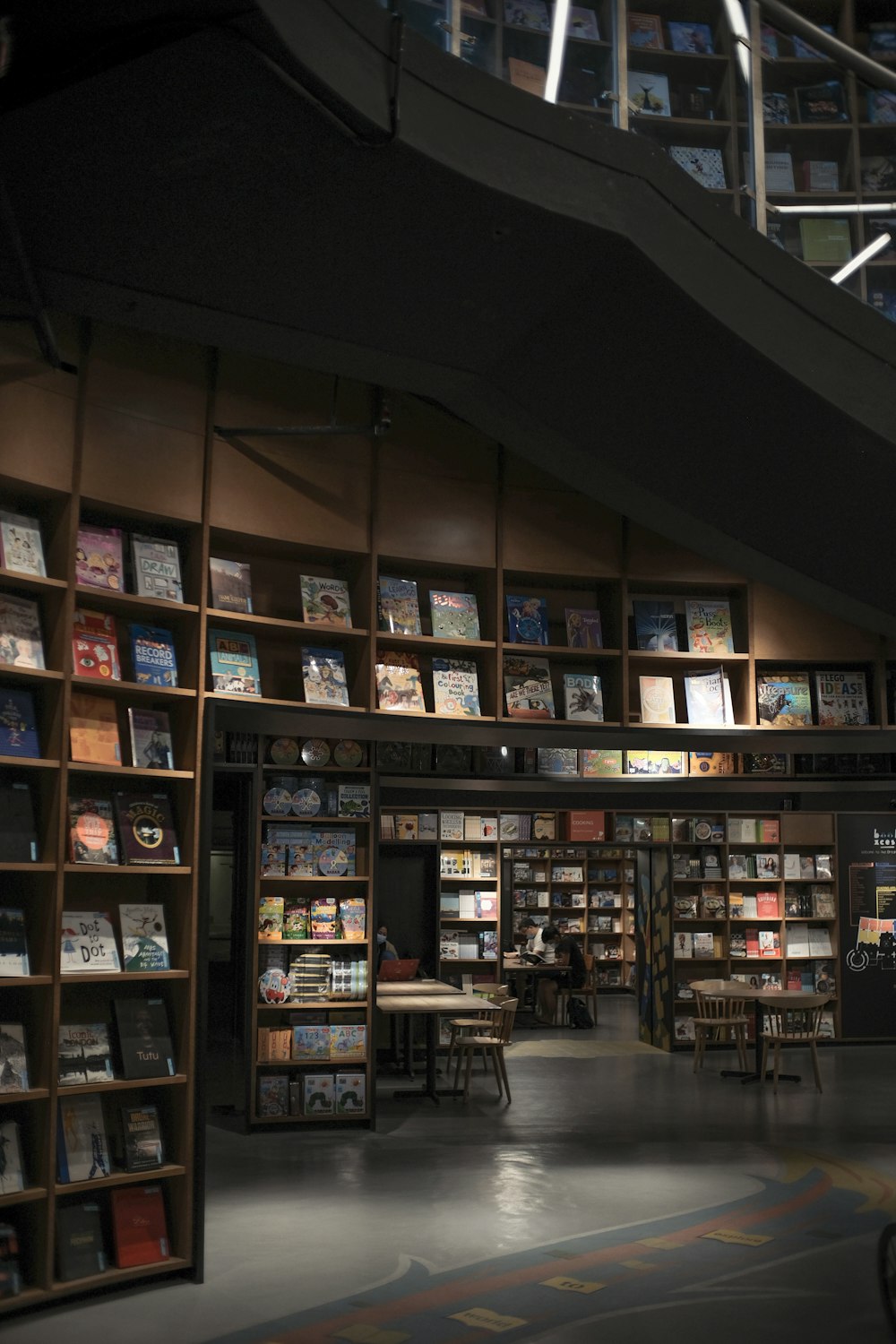 brown wooden shelf with books