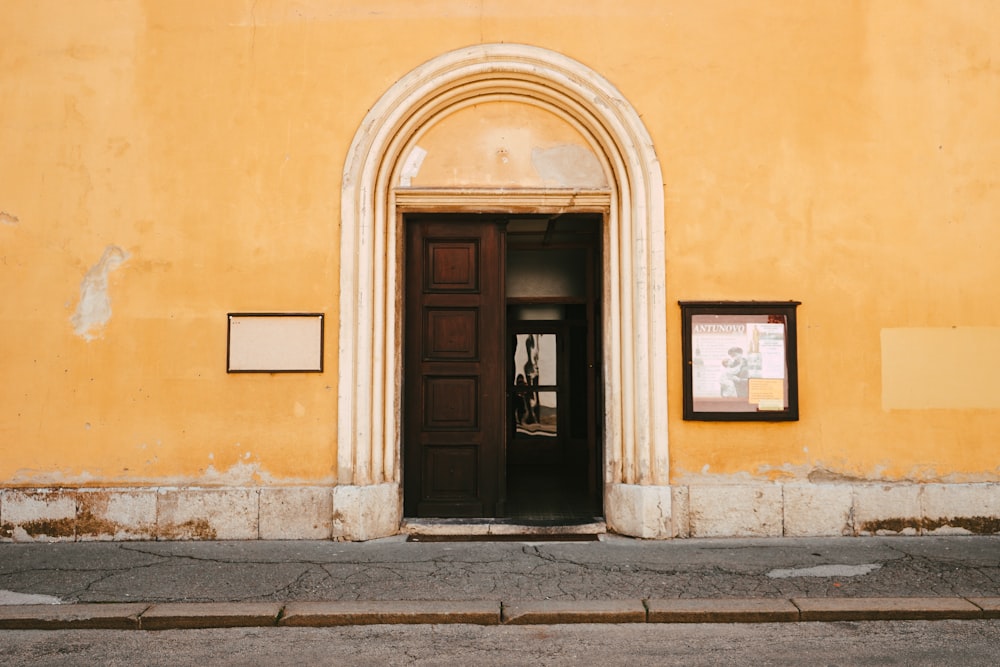 brown wooden door on brown concrete building