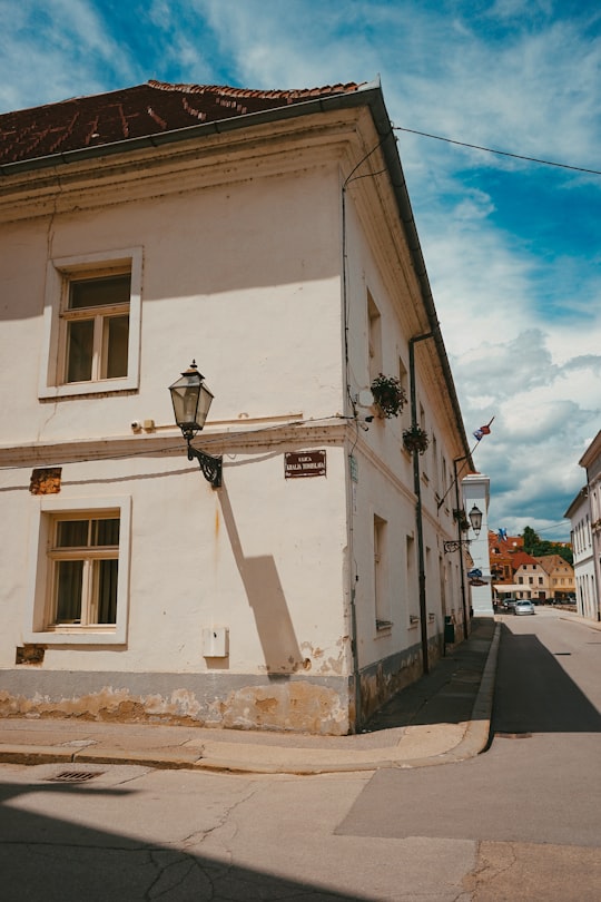 white concrete building under blue sky during daytime in Karlovac Croatia