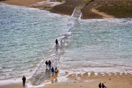 people walking on beach during daytime in Saint-Malo France