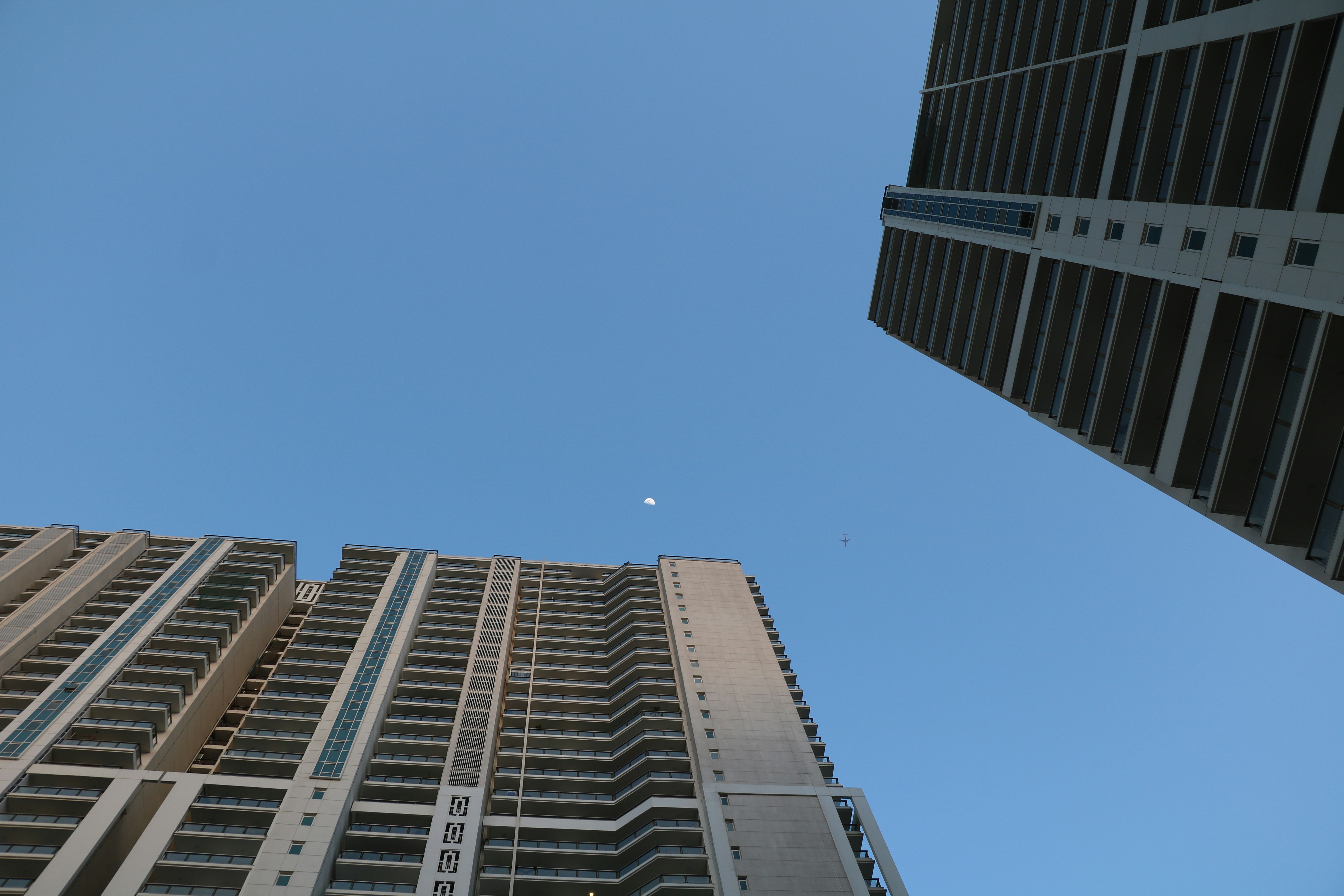 low angle photography of high rise buildings under blue sky during daytime