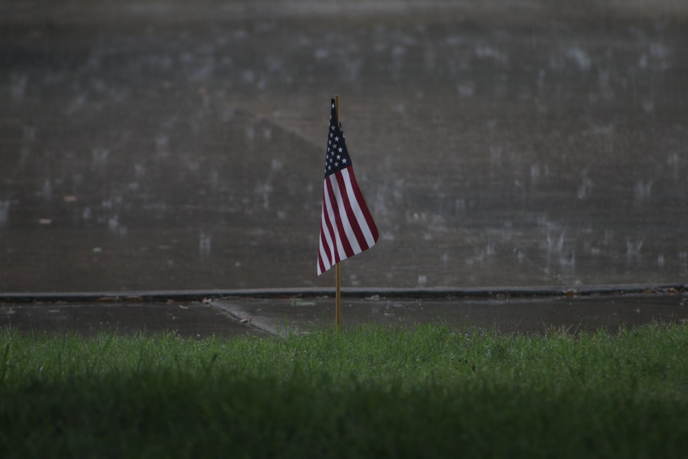 us a flag on green grass field