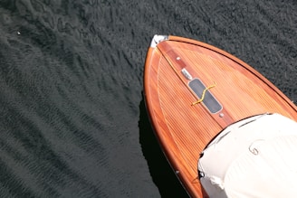 brown and white boat on water
