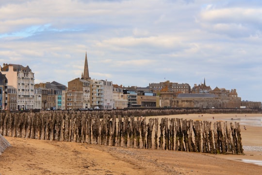 city buildings under white clouds during daytime in Saint-Malo France