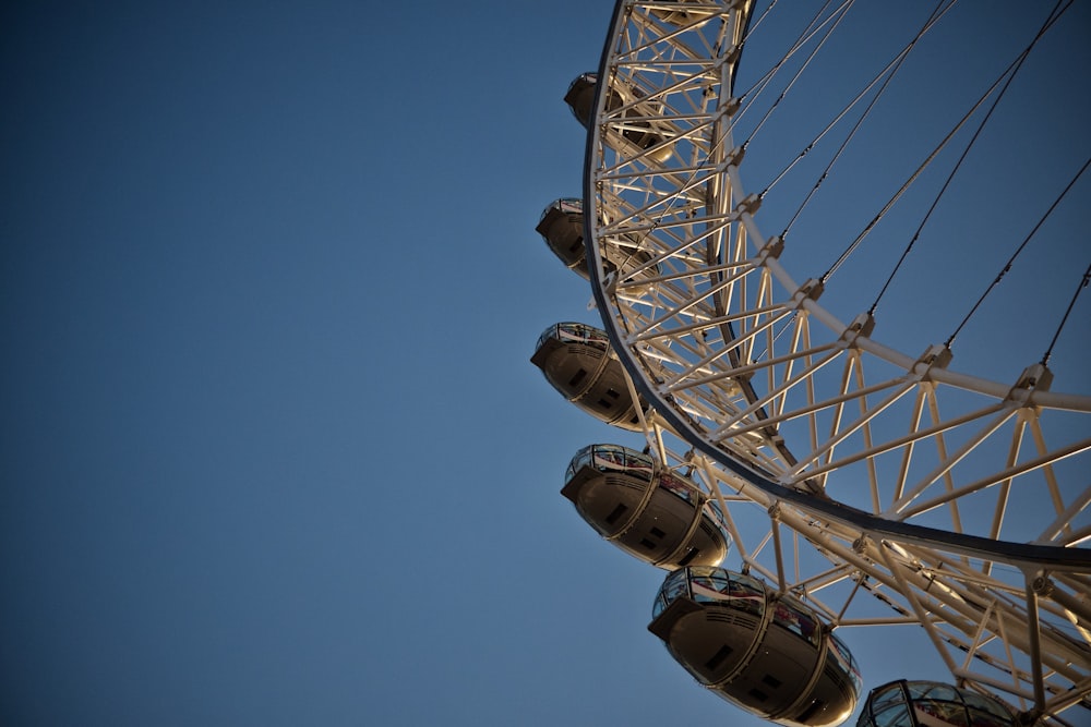 white ferris wheel under blue sky during daytime