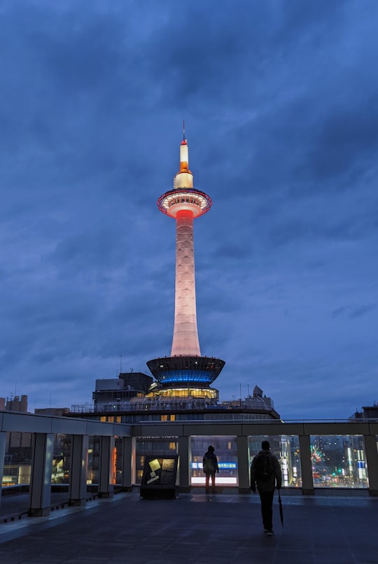 brown and white tower under cloudy sky during daytime in Kyoto Tower Japan