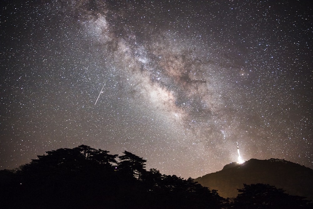 a view of the night sky with the milky in the background