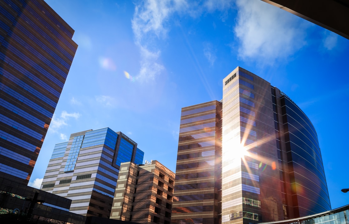 white and blue concrete building under blue sky during daytime