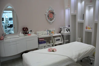 white wooden vanity table with mirror