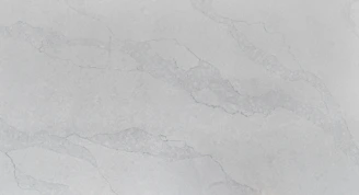Elegant marble slab with subtle gold veins under soft lighting.