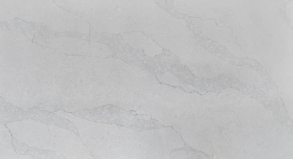 Elegant marble slab with subtle gold veins under soft lighting.