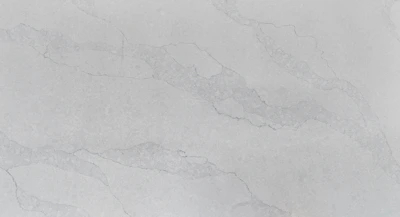 A polished limestone surface reflecting soft light, showcasing a flawless finish.