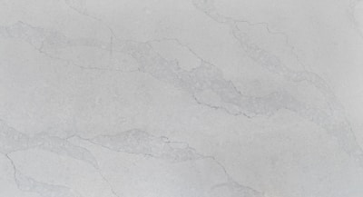 A smooth, polished surface with a light gray marble pattern. Subtle veins in a slightly darker shade run across the surface, adding an elegant texture to the stone.