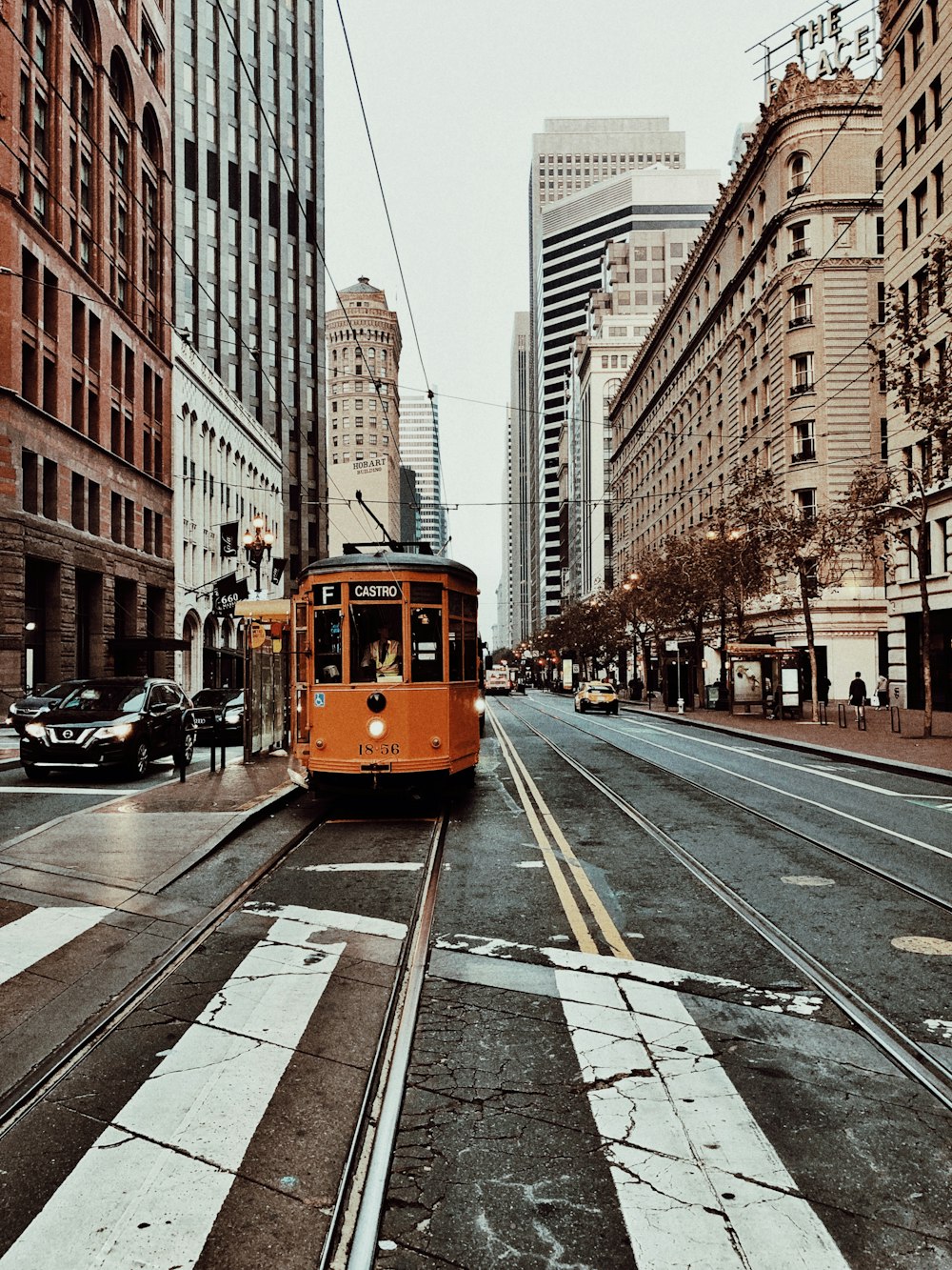 yellow and white tram on road during daytime