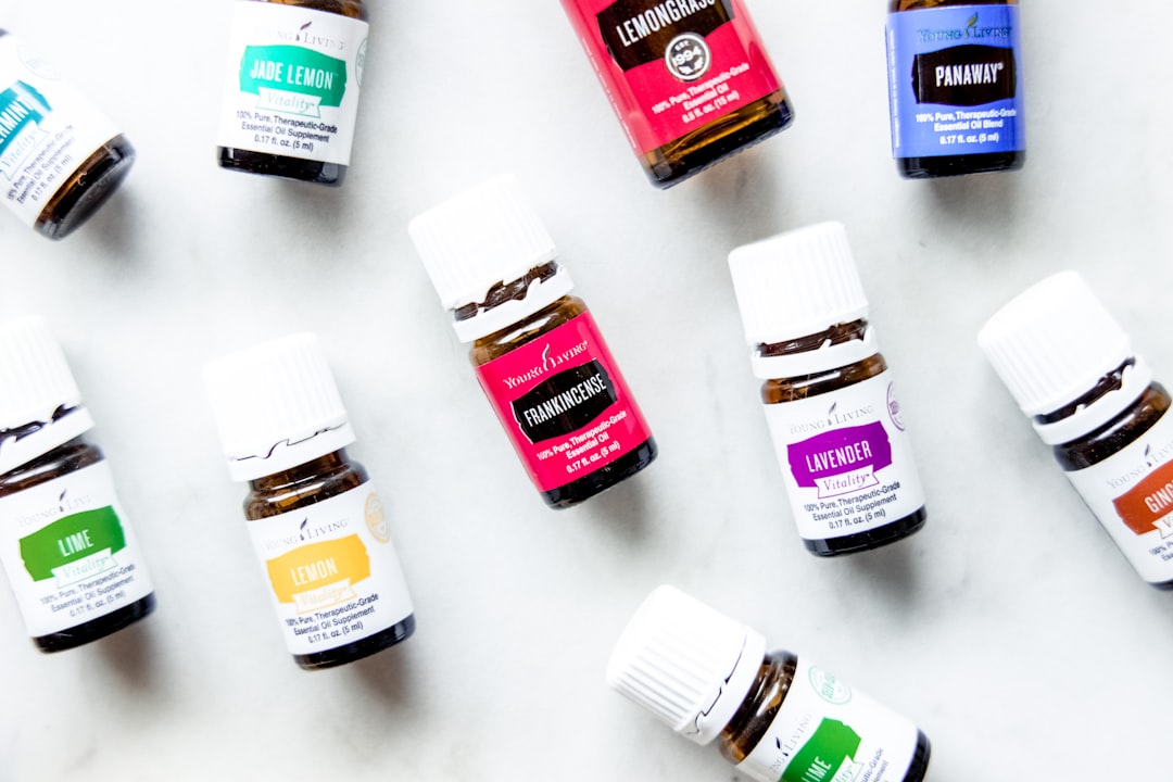 a group of bottles of essential oils on a table,
