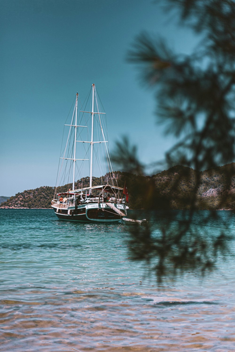 white boat on body of water during daytime