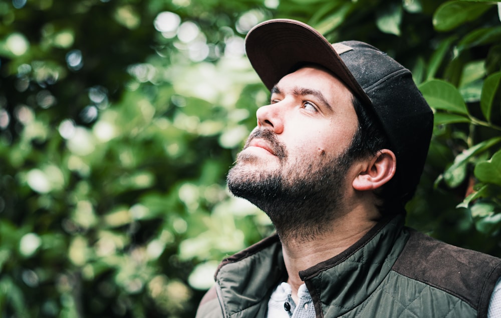 man in black leather jacket and black hat