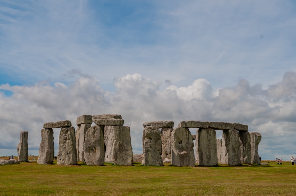 gray rock formation under white clouds during daytime