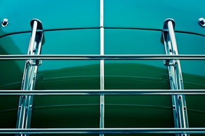 A shiny car roof rack loaded with outdoor gear, highlighted by natural wood and metal textures.