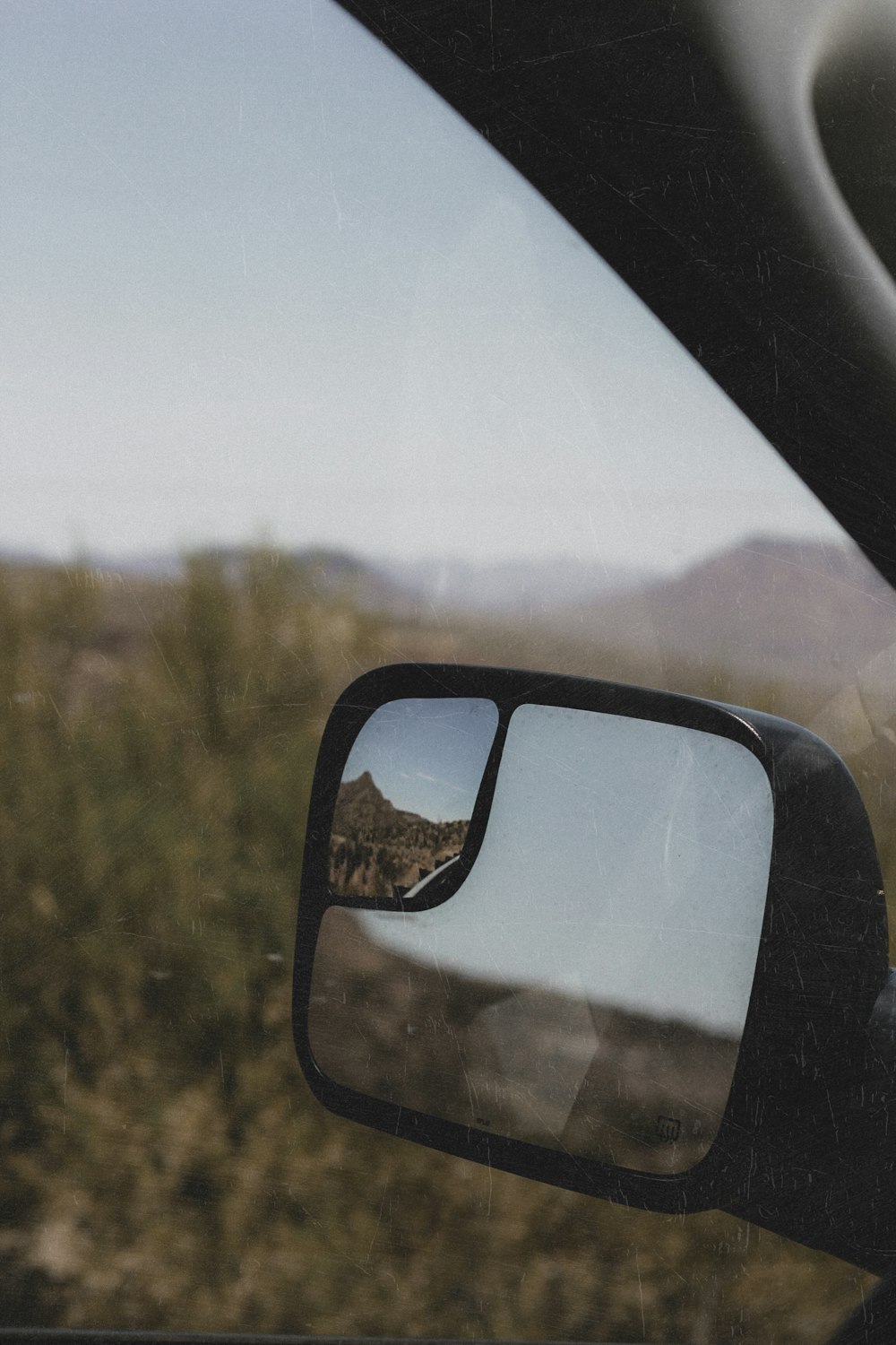 car side mirror with water droplets