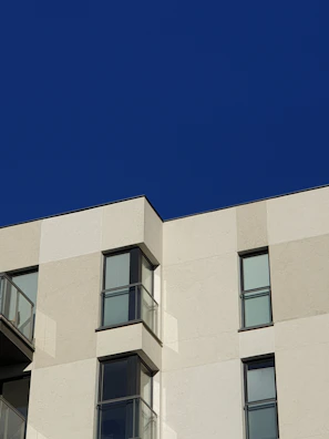 Modern residential building facade in Cuiabá with clear blue sky