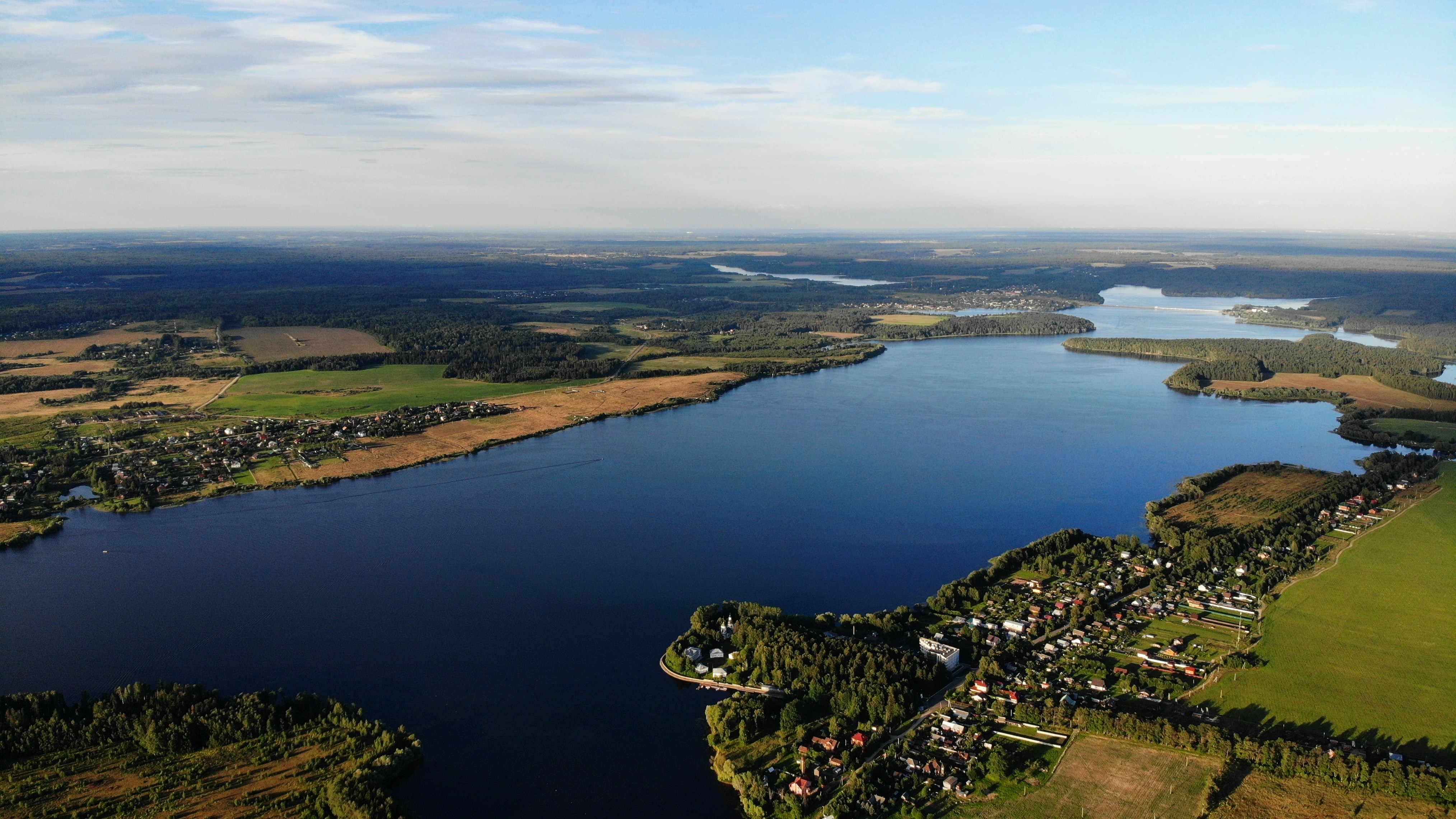 aerial view of lake and mountains during daytime