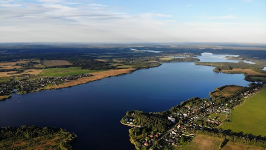 aerial view of lake and mountains during daytime in Ruza Russia