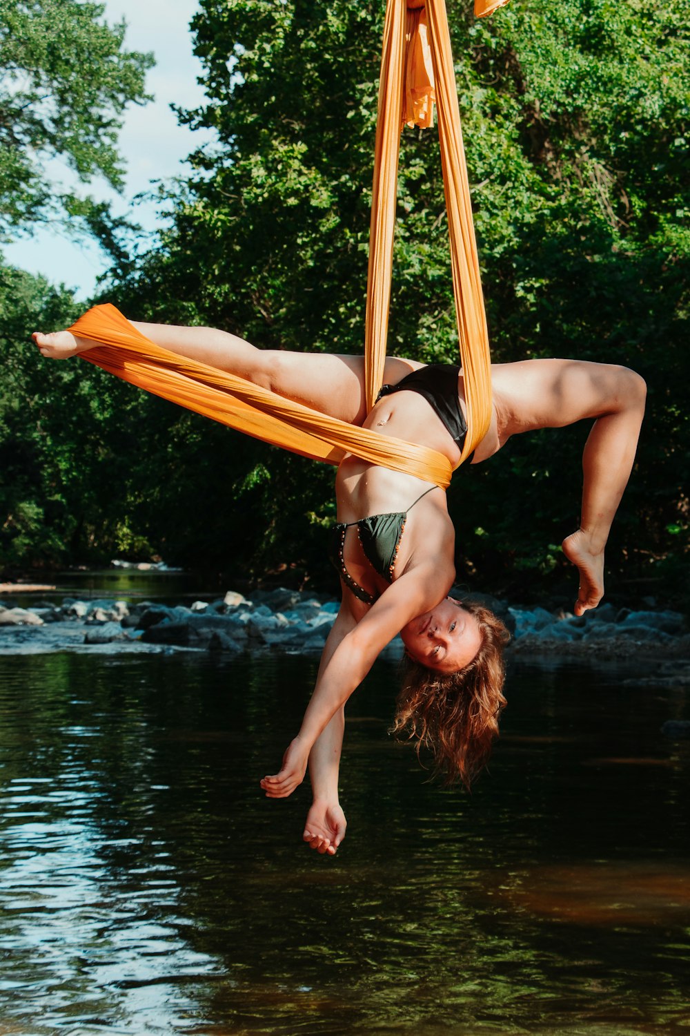 woman lying on hammock during daytime