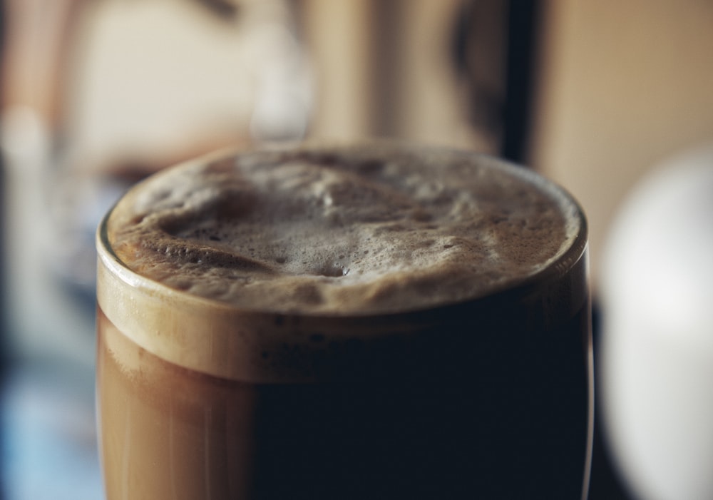 brown liquid in clear drinking glass