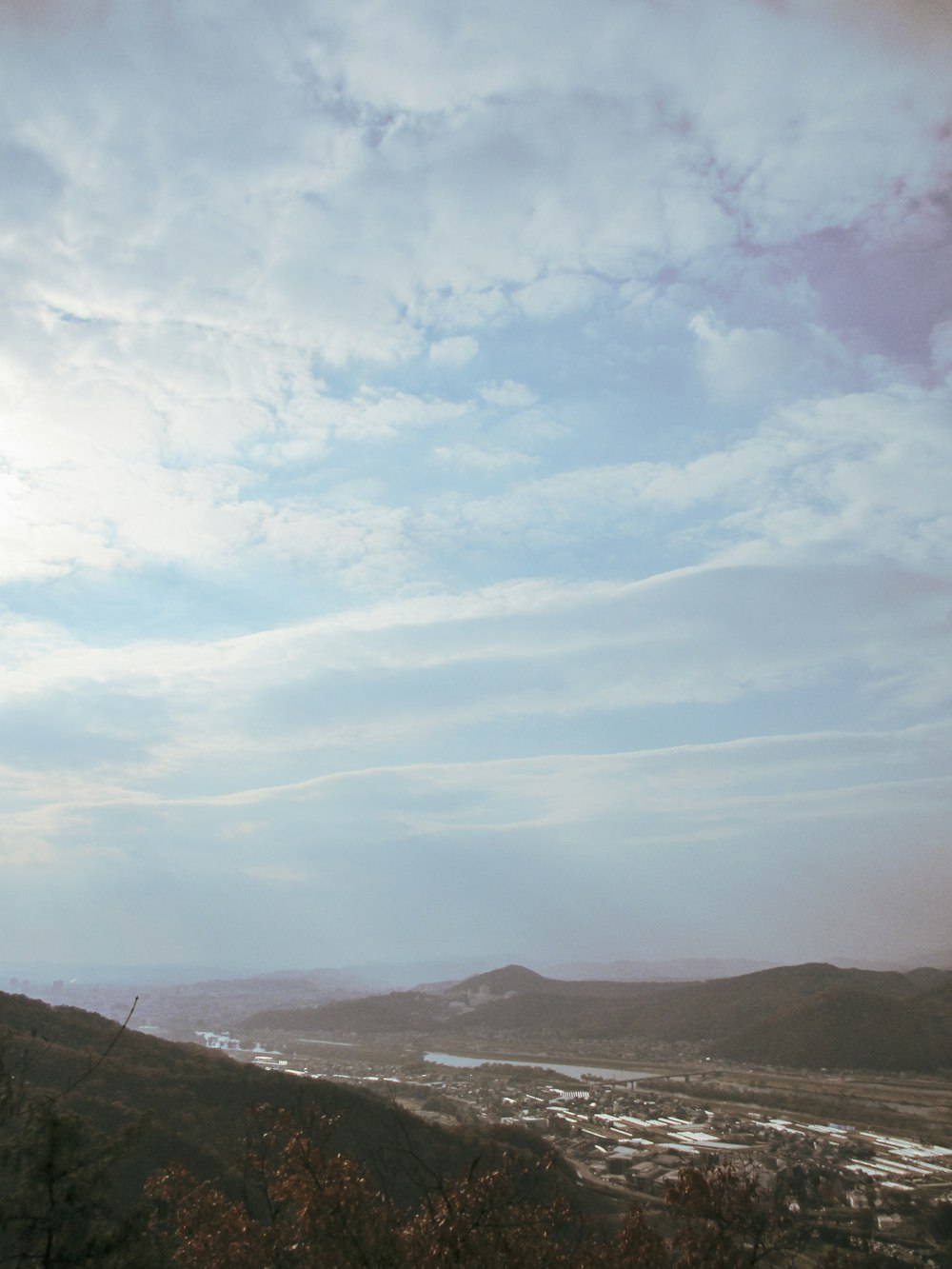 green mountains under white clouds during daytime