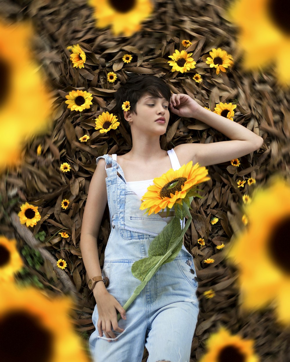 woman in white tube dress standing on sunflower field