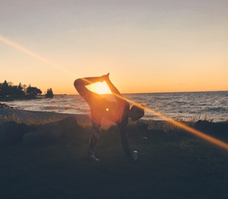 A quiet spot by a lake at sunset, ideal for stretching and yoga after a long day.