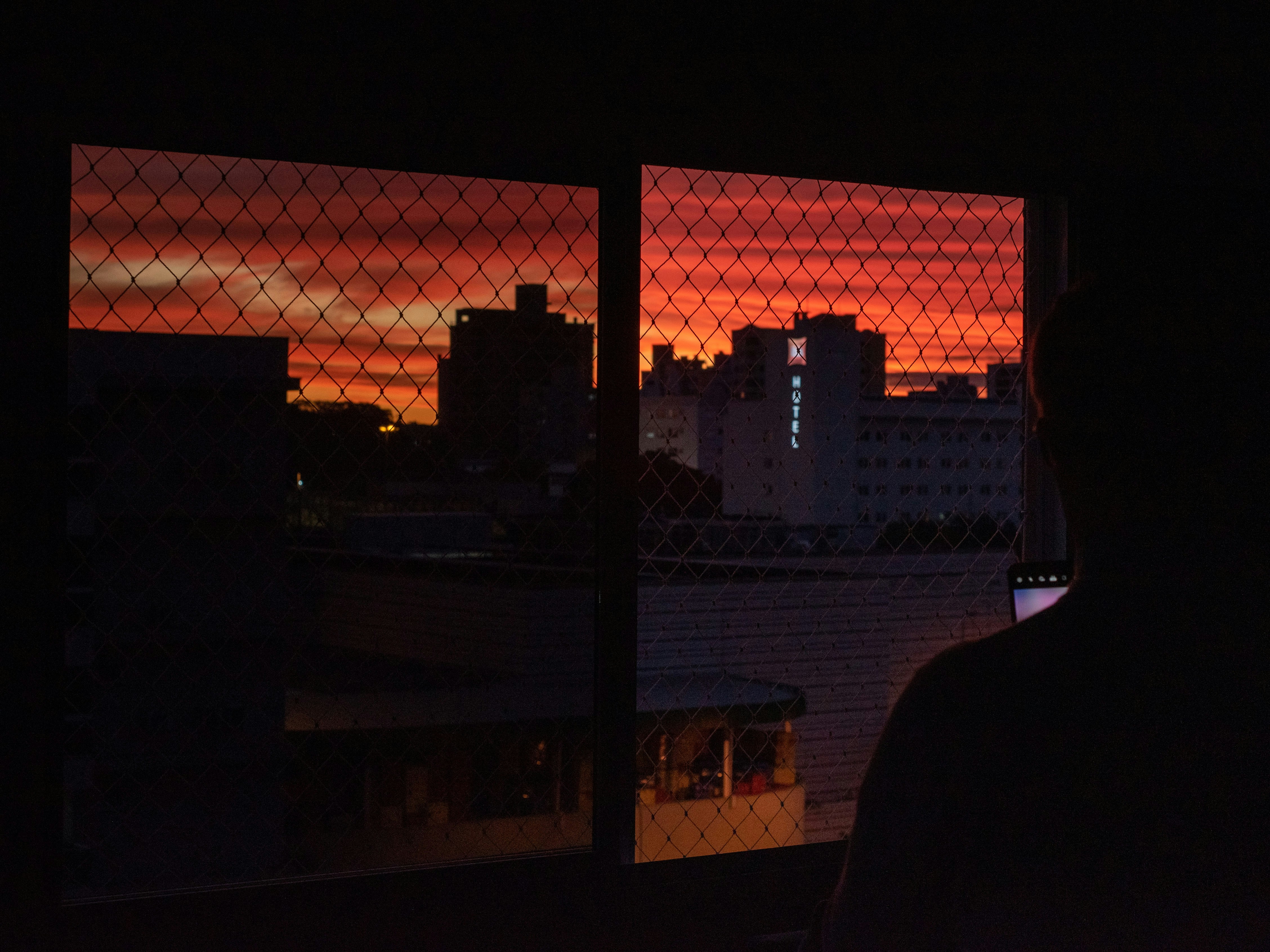 person standing near chain link fence