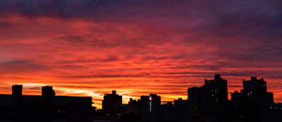 A vibrant sunset view from a luxury hotel balcony.