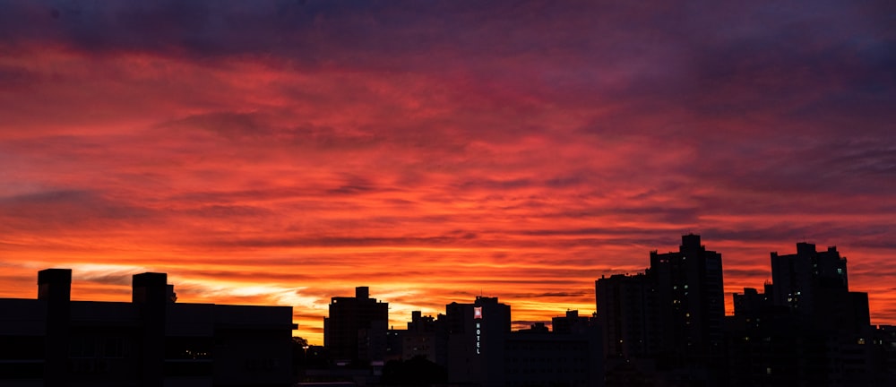 silhouette of city buildings during sunset