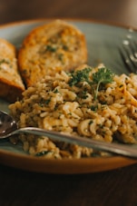 fried rice with green vegetable on brown ceramic plate